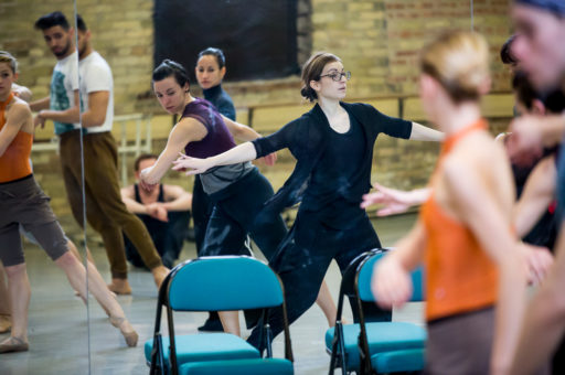 Mariana Oliveira working with dancers in the studio.